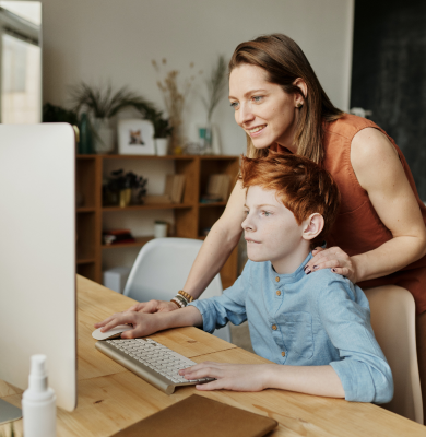 Mother and son studying together at home