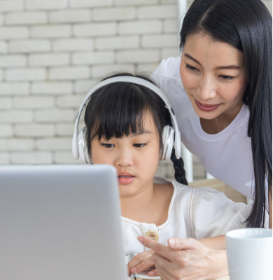 Mother and daughter studying together at home